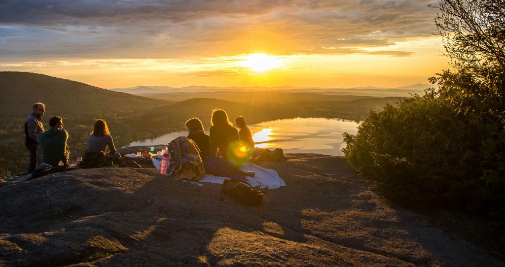 Learning together in the outdoors at sunset